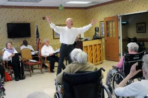 Eric Kafka leads the chorus and encourages the residents to sing along. BY STEVEN BILLUPS