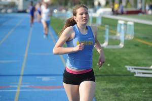 Rebekah Mills of CR is a distance star off to Columbia. BY DAVE FREDERICK