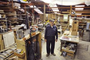 Warren Walls stands in the middle of his workshop, which sits on his 32 acres of land outside Lewes. BY NICK ROTH