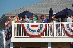 Lewes Yacht Club members join on the deck to toast another season. BY RON MACARTHUR