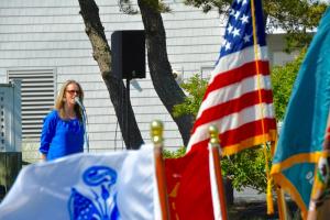 Michelle Green sings "The Star-Spangled Banner" during the LYC's Memorial Day ceremony. BY RON MACARTHUR