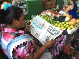 In the market in the Nicaraguan colonial city of Léon, one of the vendors sat by her colorful fruit and read one of the local newspapers. I'm always happy to see people reading newspapers and decided to share my joy. BY DENNIS FORNEY