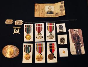 Through years of research, 15-year-old Collin Sullivan has uncovered his great-grandfather's remarkable World War II service record. To go along with Albert Kidwell's 29th Infantry Division belt buckle, dog tags and marksman badge, Collin and family friend Frank McAroy collected several medals to which Kidwell was entitled. BY NICK ROTH