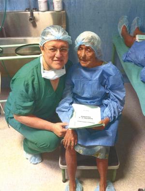 Dr. Rios, left, waits with one of his patients before her surgery. COURTESY RODOLFO RIOS