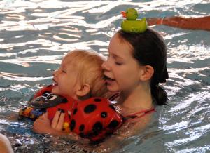 YMCA youth volunteer Diana Bird assists her little brother Fritz during the annual event. BY DAN COOK