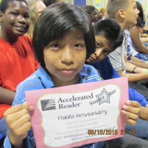 Pablo Hernandez proudly displays his Accelerated Readers Award. SOURCE SUBMITTED