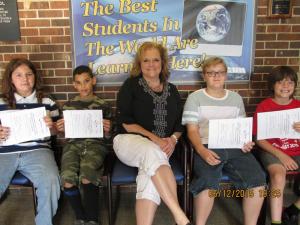 Math Olympiad high achievers scored in the top 50 percentile in the nation. Pictured (l-r) are Chad Wyman, John Small, Assistant Principal Patti Seabolt, Dylan Roberts, who scored in the top 20 percentile in the nation, and Devlin Stevenson. SOURCE SUBMITTED