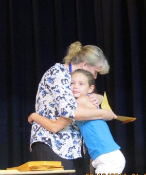 Lisamaria McNeil gets a congratulatory hug from fifth-grade teacher Chrissie Maughn. COURTESY SUBMITTED