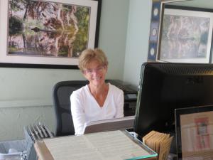 Receptionist Mary Vallery helps clients find the right therapist and modality for therapeutic purposes and relaxation at One Spirit Massage Studio. BY MOLLY MACMILLAN