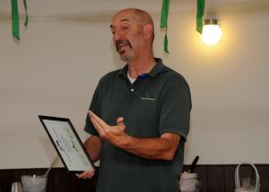 State Park superintendent Paul Faircloth spoke of the service by O'Day before presenting him with the Outstanding Volunteer certificate. BY DAN COOK