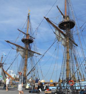 With the web of lines for the sailing rig behind him, Nancy Glass director of business development Ben Fetterman (red hat) checks on some last minute details before setting sail for the day. BY CHRIS FLOOD