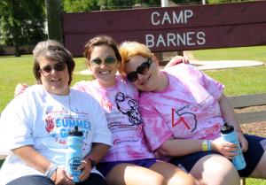 Counselor Hannah Worsh, center, relaxes with SODE athletes Deborah McDaniel, left, and Kimberly Strunk. BY DAN COOK
