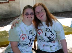 Rachel Rhea, left, and Torrie Moore are long time friends at the SODE camp. BY DAN COOK