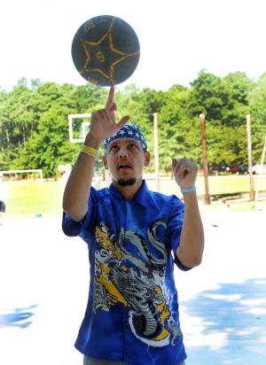 Oliver Dynes does his Pistol Pete spin during a basketball activity. BY DAN COOK