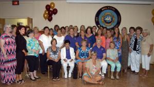 Current members of the Milton Fire Department Ladies Auxiliary - there are 57 in total, not all shown here - pose for a photo after a luncheon Aug. 8 celebrating the group's 50th anniversary. BY MADDY LAURIA