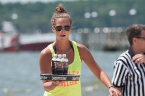 Tatum Jones from the winning team Fins concentrates in the traditional bottle carry event. BY DENY HOWETH