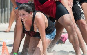 Felicia Jenson crawls through her teammates. BY DENY HOWETH