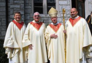 After the Mass, Bishop Francis Malooly pauses for a photo with the former and present priests of St. Edmond. Shown are (l-r) the Rev. Piekarski, 2013-15; the Rev. Raymond Forester, 2000-13; Bishop Malooly; and the Rev. William Cocco, present pastor. BY STEVEN BILLUPS