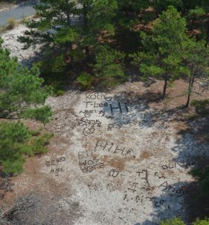 This large open area of sand is a favorite location for people to leave tower artwork. BY RON MACARTHUR