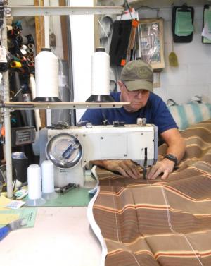 Trim shop owner Mike Sockriter stitches a straight line. BY CHRIS FLOOD