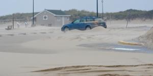 Sand covers the Lewes Beach parking lot. BY RON MACARTHUR