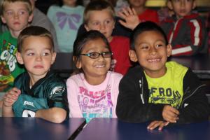 Smokey Bear's arrival makes an impression. Pictured are (l-r) Jayden Matthews, Vaidehi Patel and Anderson Puac-Escalante. BY MELISSA STEELE