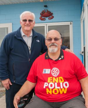 Polio survivors Dave Keller, left and John Nanni at the Rotary Crab Feast benefit to eradicate polio. BY DENY HOWETH