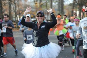 Kelly Snow is running 35 races in her 35th year as a way of battling through postpartum depression. Kelly is tough; she is also an Eagles fan. BY DAVE FREDERICK