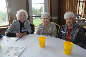Chatting at the table are (l-r) Anna Louise Thompson Bradley, class of '43; Mary Knox Workman, class of '44; and Mildred Smith-Welk, class of '44. Workman and Smith-Welk have been friends since grade school. BY STEVEN BILLUPS