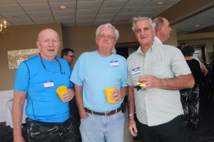 Enjoying the social atmosphere are (l-r) Butch Marvel, class of '61; Jim Stevenson, class of '66; and Jerry Weller, class of '61. BY STEVEN BILLUPS
