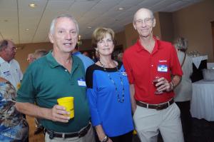 Merrill Moore, left, class of '62, stands with his cousin Myrna Moore Abbott, class of '64, and Tim Abbott. Myrna and Tim Abbott were high school sweethearts. BY STEVEN BILLUPS