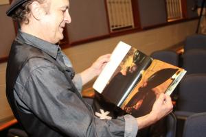 Kurt Yaghjian shows a still shot from "Jesus Christ Superstar" that featured he and Bob Bingham as high priests Caiaphas and Annas. BY MELISSA STEELE