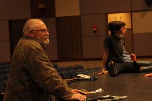 Bob Bingham watches students warm up for theater class. BY MELISSA STEELE