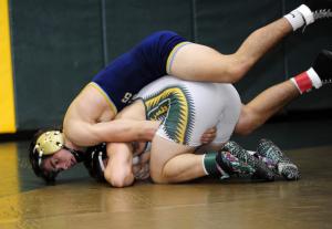 Cory Lawson rides Indian River's Zeke Marcozzi in the 160-pound class. The back-and-forth rivalry was won this time by Marcozzi. BY DAN COOK