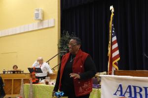 Gloria Holland sings at the AARP December meeting. SOURCE SUBMITTED