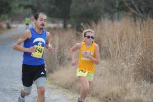 Martin Rodriguez escorts Katie Kuhlman to the finish line. BY DAVE FREDERICK