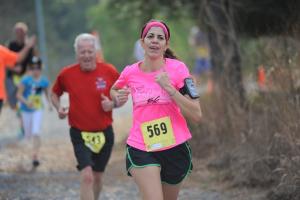 Jackie Quigley, a local favorite person, leads Jack Huxtable, an age-group state record holder. BY DAVE FREDERICK