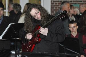 Alan Fogleman plays a solo during the Cape Jazz Band's performance on Second Street. BY NICK ROTH