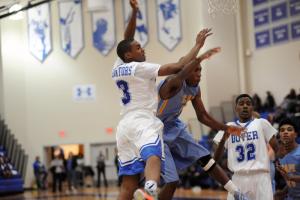 Noah Piper is defended by Tre'vonne Moore. BY DAVE FREDERICK