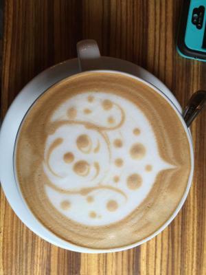 A cup of green tea Matcha latte at the Moore coffee house in Seattle. Creativity along with great flavor, caffeine and L-theanine. Puts some hippity hop in your giddy up.