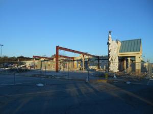 Demolition of the building closest to the southbound Exxon Mobile is nearly complete. BY CHRIS FLOOD