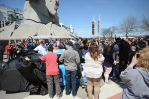 Autism Delaware representatives unveil the Smithfield Richard Petty Motorsports number 43 before it is installed in Miles the Monster's hand. BY STEVEN BILLUPS