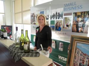 WSFS associate Julie Marr moonlights after banking hours as a bartender for their second community networking fundraiser in Millsboro. BY MOLLY MACMILLAN