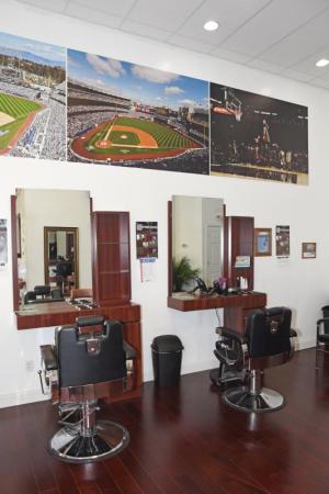 The barbershop is decorated with myriad sports photographs. BY NICK ROTH