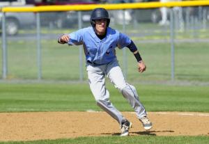 Parker Savage gets a jump while pinch running. BY DAN COOK