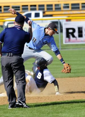 Zack Gelof tags out a Sallies base runner after a Richard Carey pick-off throw. BY DAN COOK