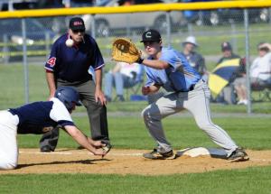 Cape first baseman Connor Thompson gets a pick-off attempt from pitcher David Erickson. BY DAN COOK