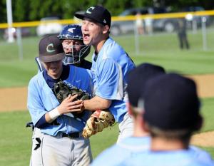 Pitcher David Erickson, center, is the first to meet and congratulate second baseman Gordon Boslet after his terrific play from second. BY DAN COOK