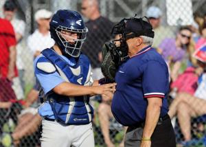 Cape catcher Richard Carey checks on the umpire after a foul ball. BY DAN COOK