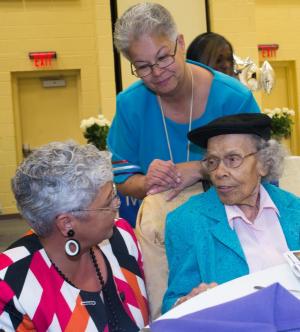 Elder Cora Selby, right, is flanked by keynote speaker Dr. Freda Lewis-Hall and Chief Natosha Carmine. BY DENY HOWETH
